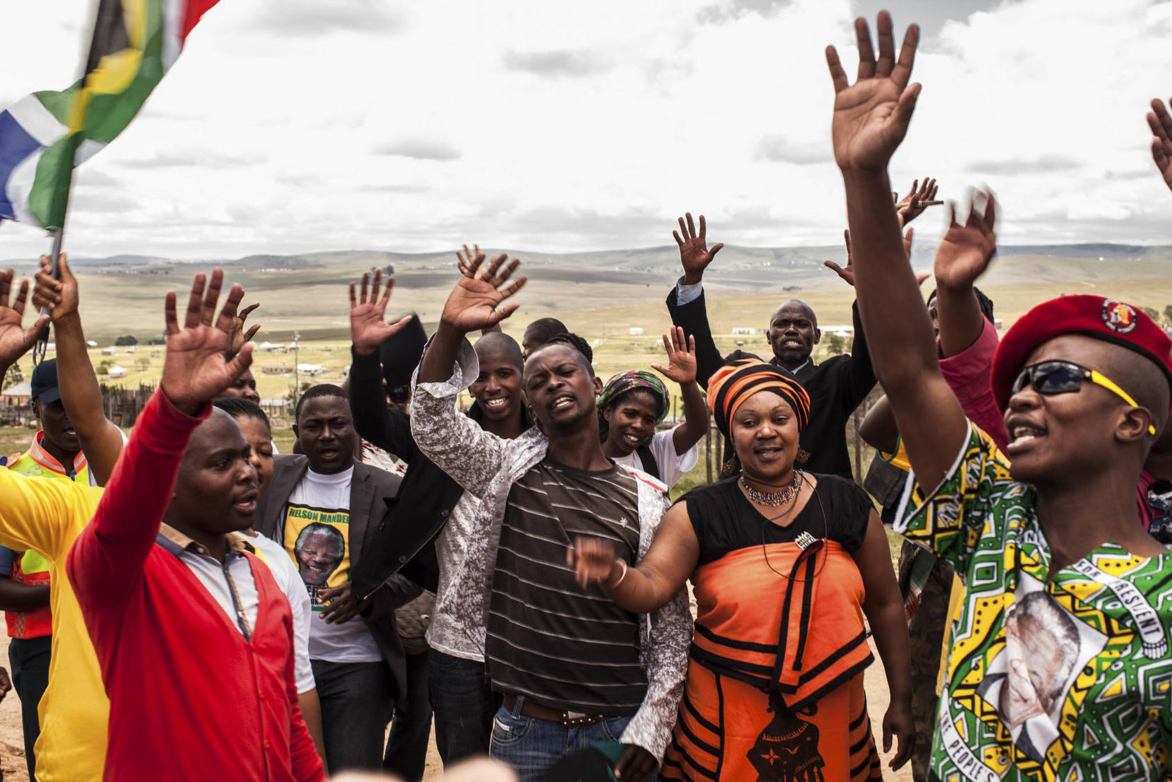South Africans sing songs of liberation after the burial of former South African President Nelson Mandela in Qunu, South Africa. a different world